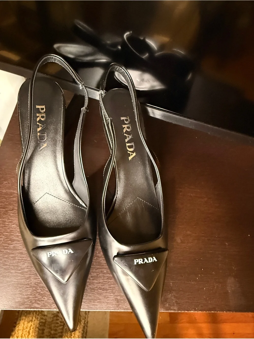 Prada Black Leather Pointed Slingback Heels with Logo Plaque